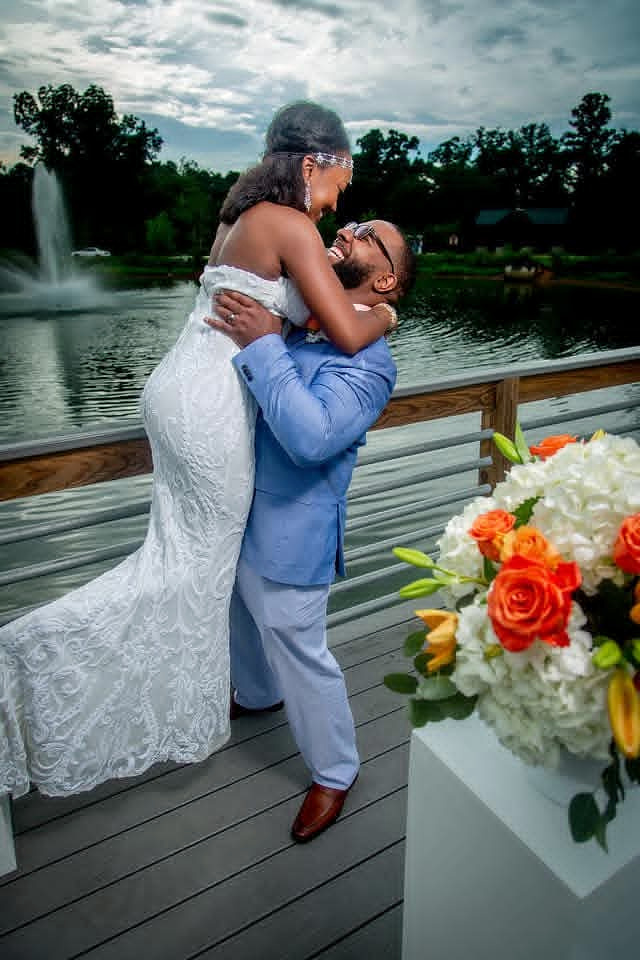 Sharita and Ashley embracing on their wedding day